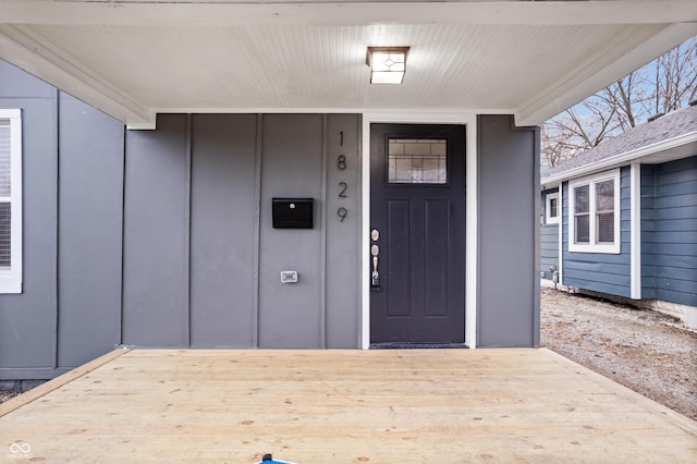 entrance to property with a wooden deck