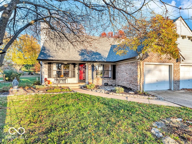 view of front of house featuring a garage, a front yard, and covered porch