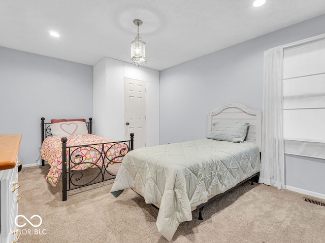 bedroom with light colored carpet