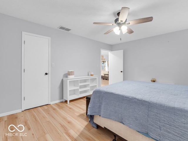 bedroom featuring hardwood / wood-style floors and ceiling fan