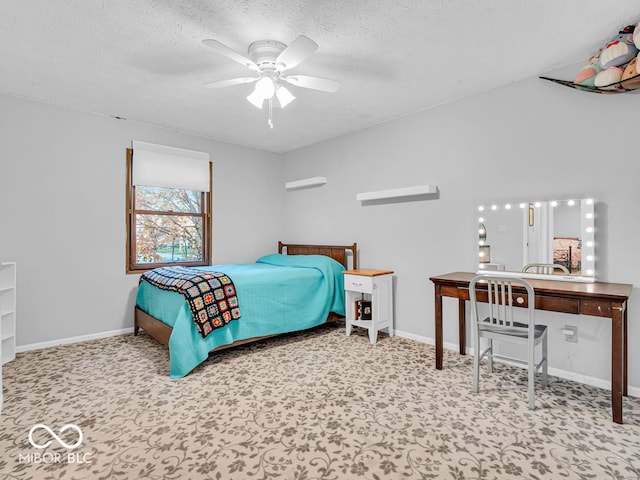 bedroom featuring ceiling fan and a textured ceiling