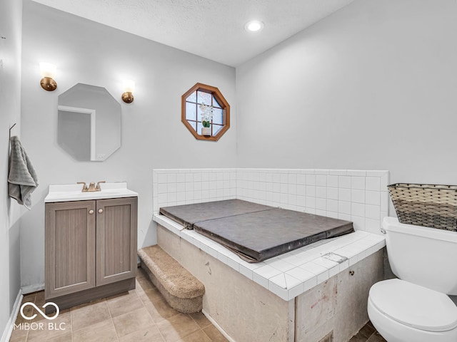 bathroom featuring tile patterned flooring, vanity, and toilet