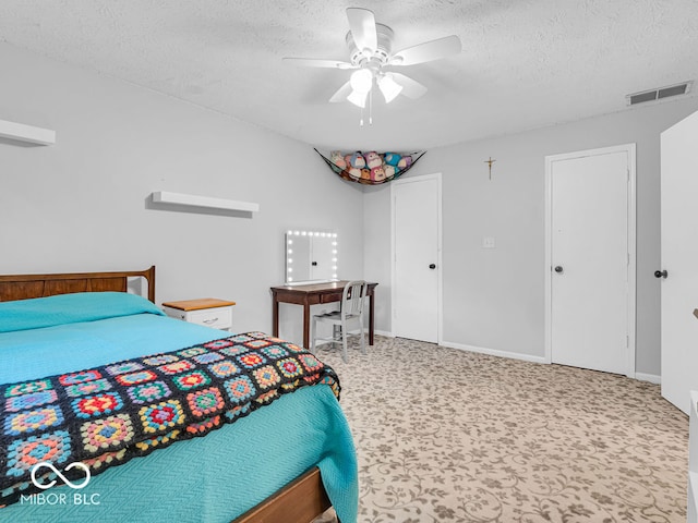 bedroom featuring a textured ceiling and ceiling fan