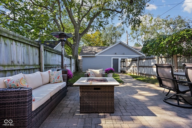 view of patio featuring an outdoor living space with a fire pit