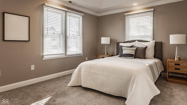 carpeted bedroom with multiple windows and crown molding