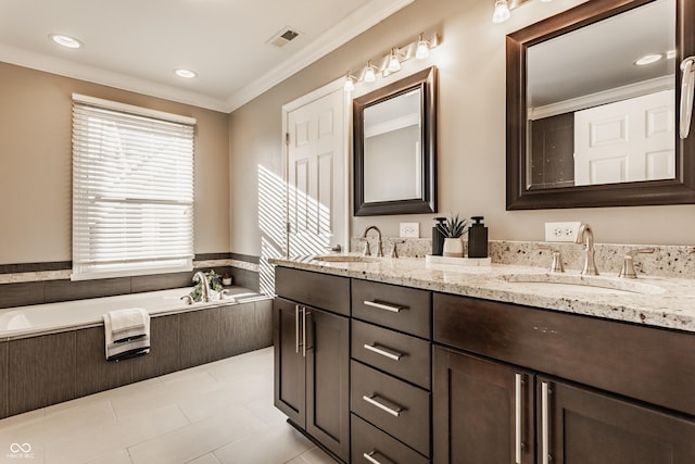 bathroom featuring tile patterned floors, crown molding, vanity, and a relaxing tiled tub