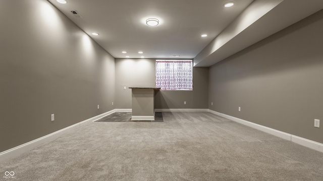 basement featuring carpet flooring