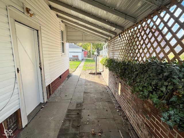 view of patio featuring an outdoor structure