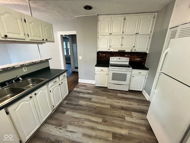 kitchen featuring white cabinets, dark wood-type flooring, a textured ceiling, and white appliances