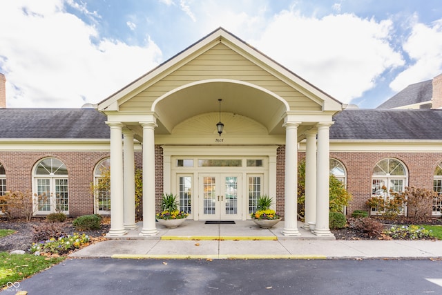 property entrance featuring french doors