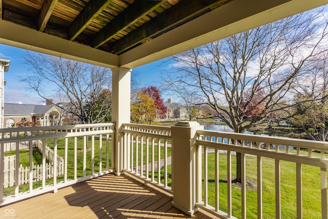 wooden terrace with a lawn