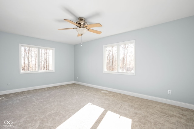 carpeted empty room with ceiling fan