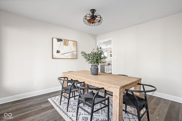 dining space with dark wood-type flooring