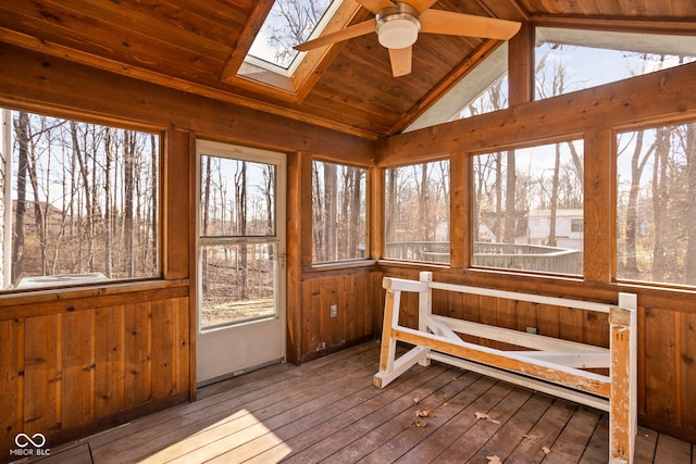 sunroom / solarium featuring lofted ceiling with skylight, ceiling fan, and wood ceiling