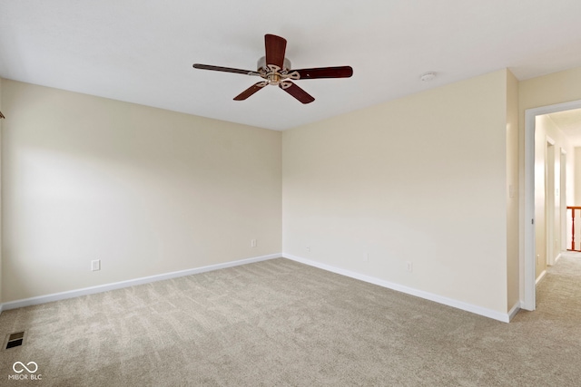 carpeted empty room with ceiling fan