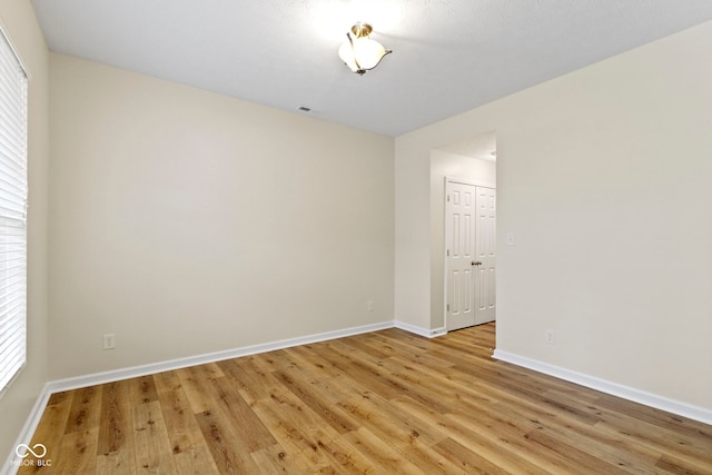 unfurnished room with light hardwood / wood-style flooring