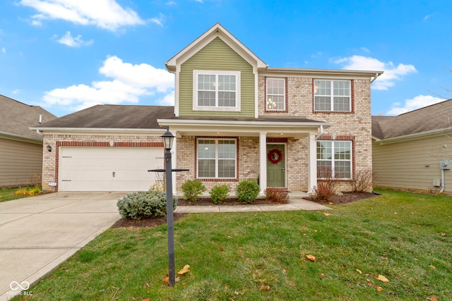 view of front of property featuring a front yard and a garage