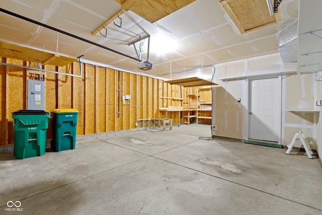 garage featuring electric panel and a garage door opener