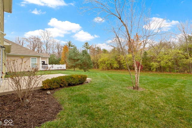 view of yard with a wooden deck