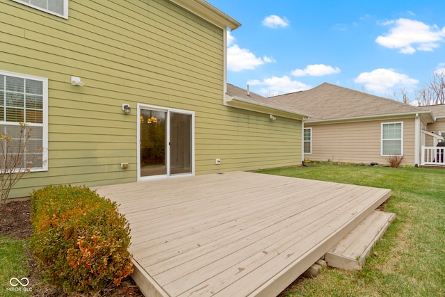 wooden deck with a lawn