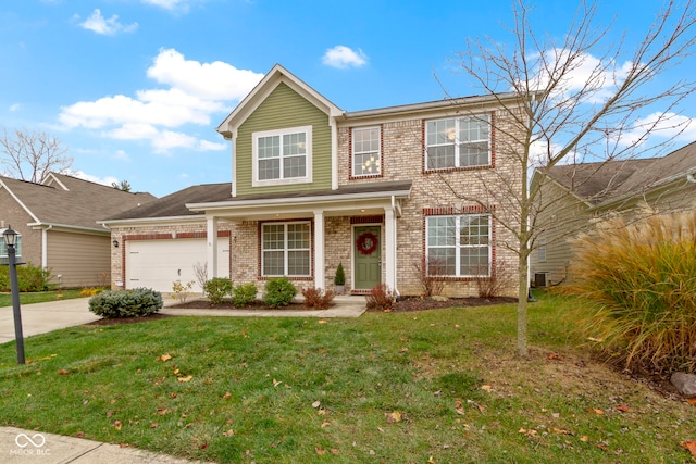 view of front of house featuring a front yard and a garage