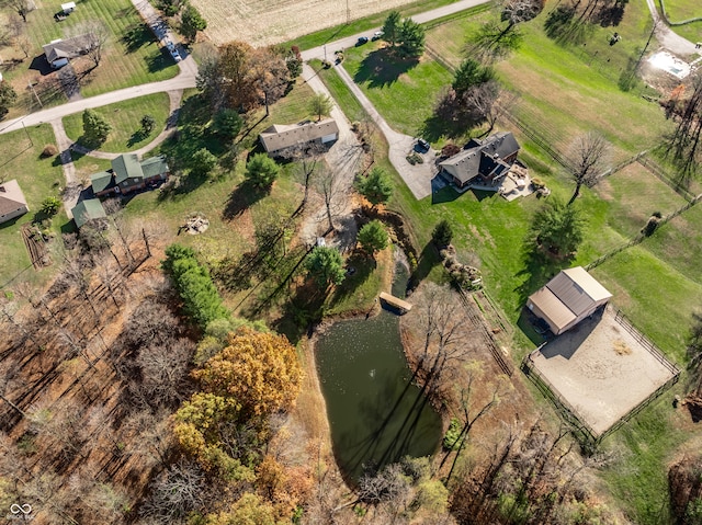 drone / aerial view featuring a water view and a rural view