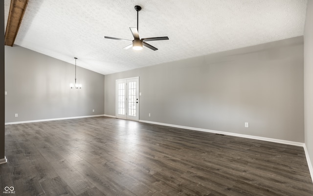 unfurnished room with a textured ceiling, lofted ceiling with beams, dark hardwood / wood-style flooring, and ceiling fan with notable chandelier