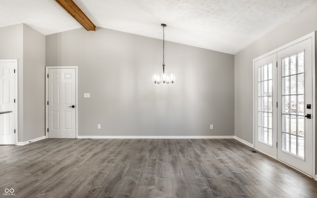 unfurnished dining area with a textured ceiling, vaulted ceiling with beams, hardwood / wood-style flooring, and an inviting chandelier