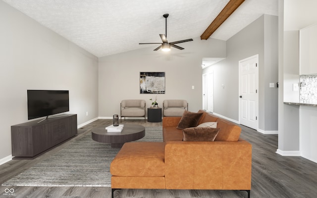 living room featuring ceiling fan, dark hardwood / wood-style flooring, lofted ceiling with beams, and a textured ceiling