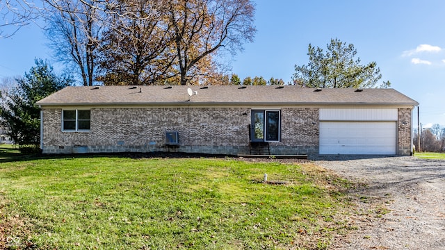 exterior space featuring a yard and a garage