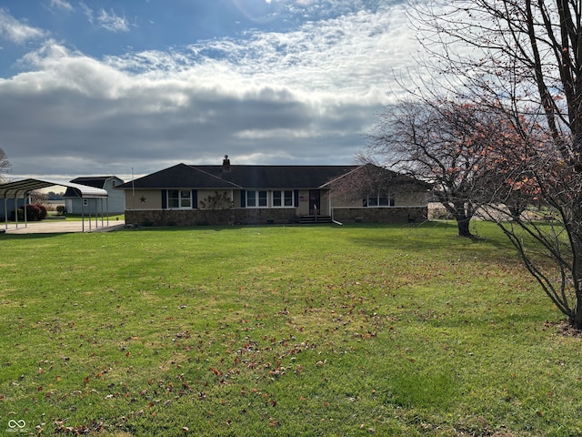 exterior space with a lawn and a carport