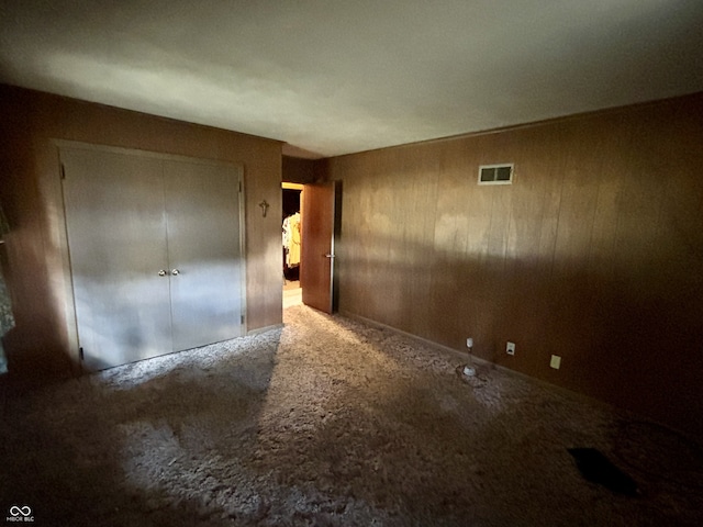 unfurnished room featuring carpet