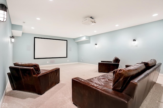 cinema room featuring light colored carpet