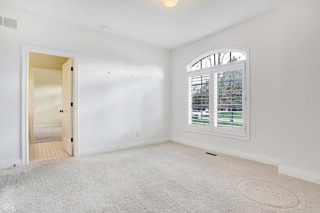 unfurnished room with carpet floors