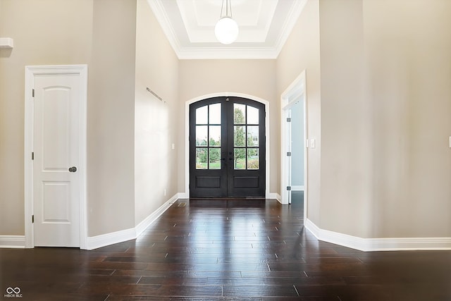 foyer entrance with dark hardwood / wood-style flooring, french doors, and crown molding