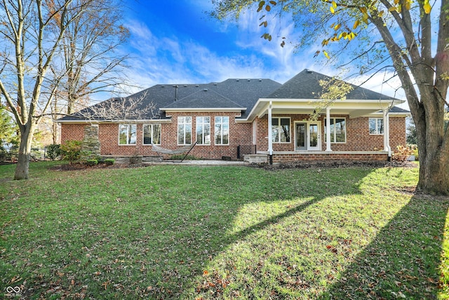 back of house featuring a yard