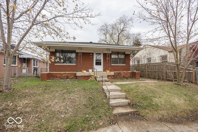 bungalow featuring a front yard