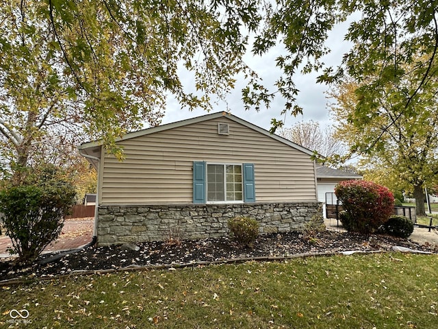 view of property exterior with a yard