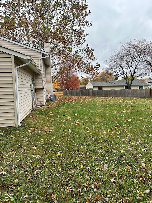 view of yard featuring central air condition unit