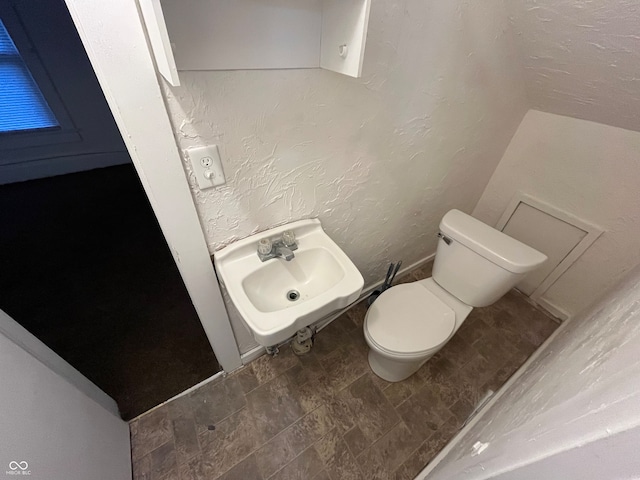 bathroom with sink and toilet