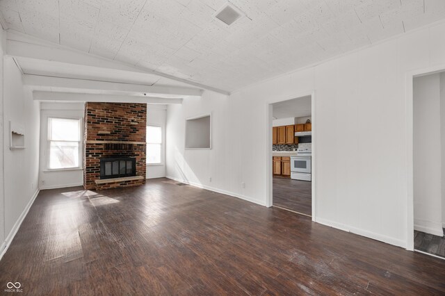 unfurnished living room with a fireplace and dark hardwood / wood-style floors