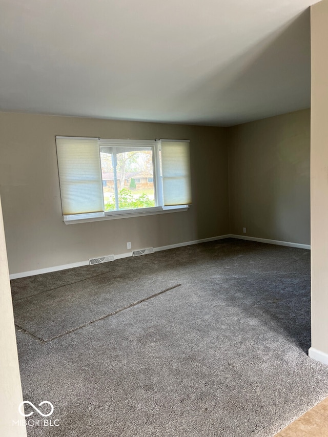 unfurnished room with carpet flooring