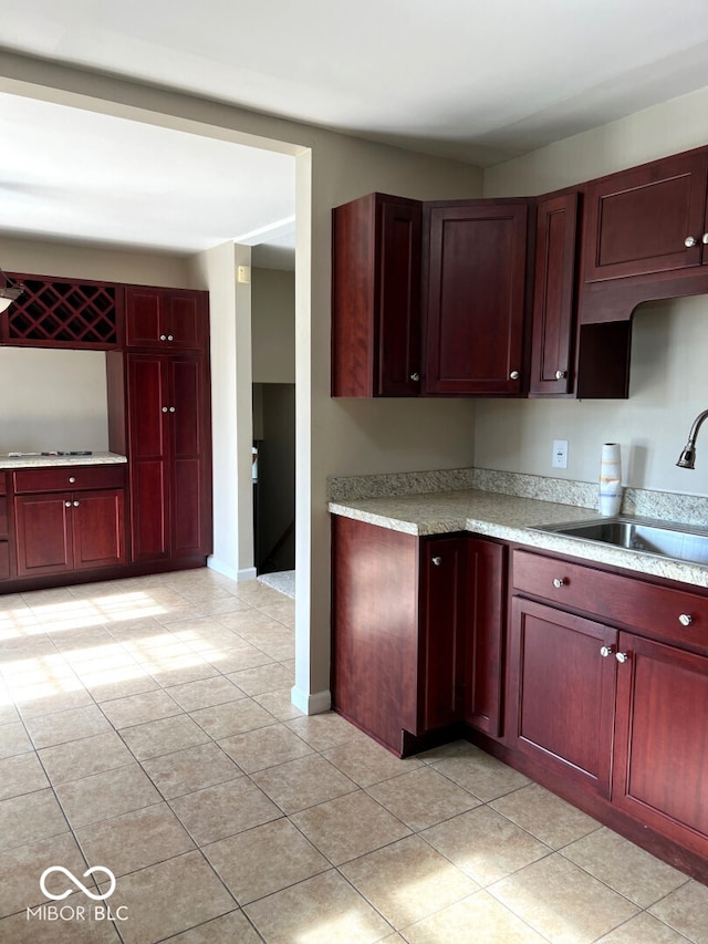 kitchen with sink and light tile patterned floors