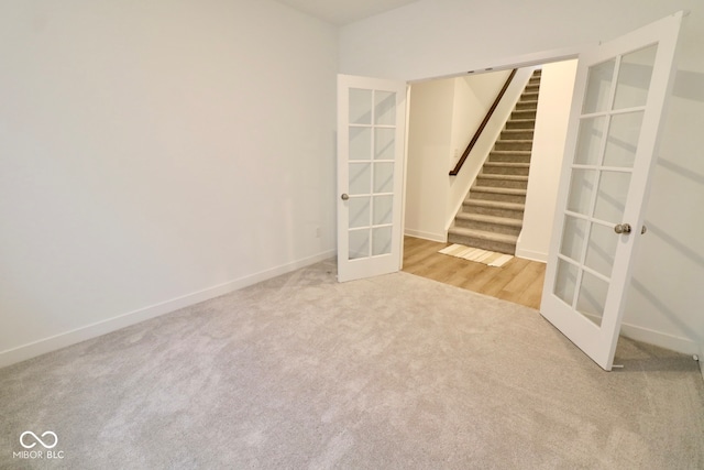 spare room with french doors and carpet floors