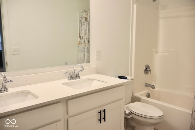 full bathroom featuring shower / bath combo, vanity, and toilet