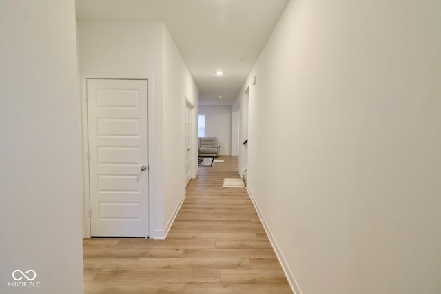 hall with light wood-type flooring