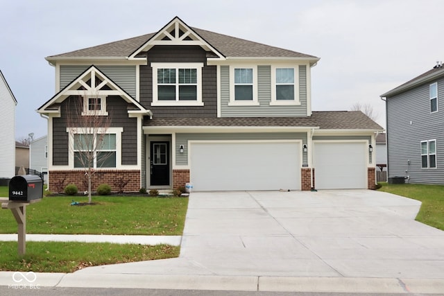 craftsman-style home with a garage and a front lawn