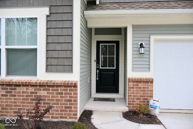 property entrance with a garage