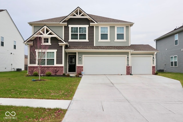 craftsman house featuring a garage, cooling unit, and a front yard