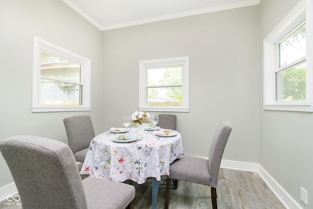 408 W 11th St, Anderson, IN 46016 - dining room with wood finished floors, baseboards, and ornamental molding